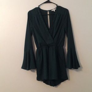 Forest green v-neck romper with pockets.